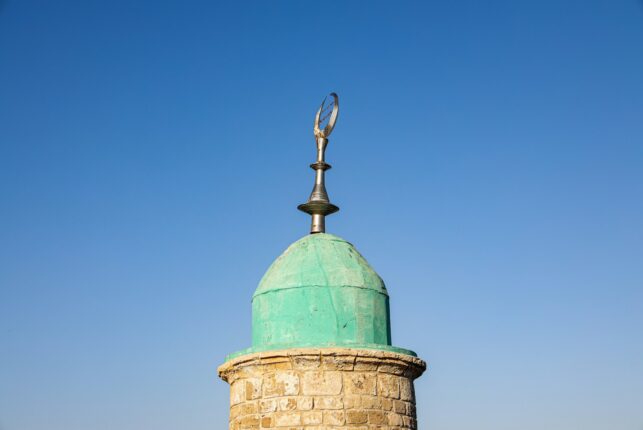 green and brown stone tower